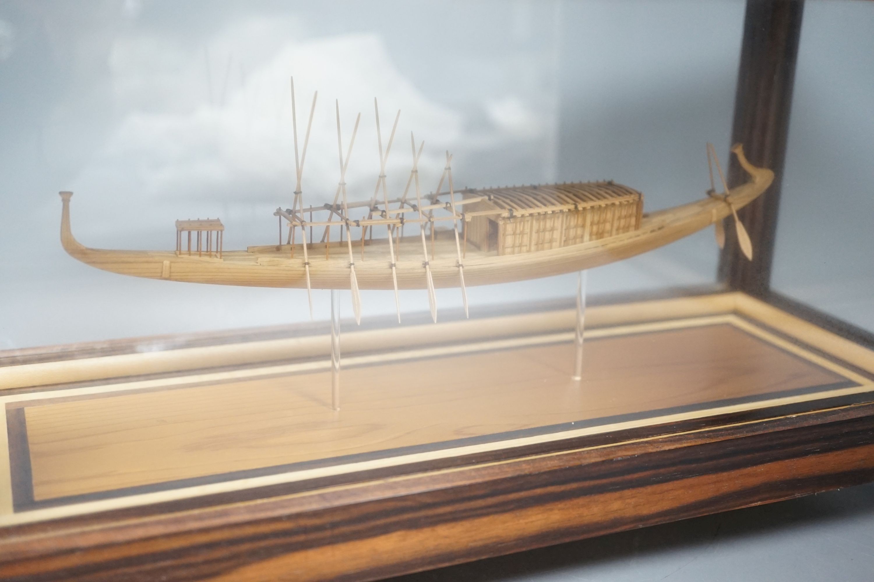 A calamander cased model of an Ancient Egyptian barge, width 42 cms